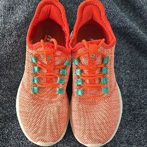 Stylish Orange Athletic Shoes with Teal Highlights